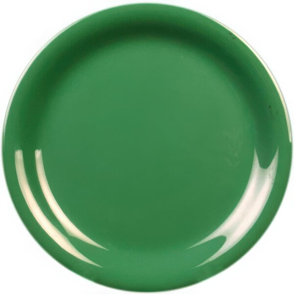 A close-up of a green plate with a white narrow rim.