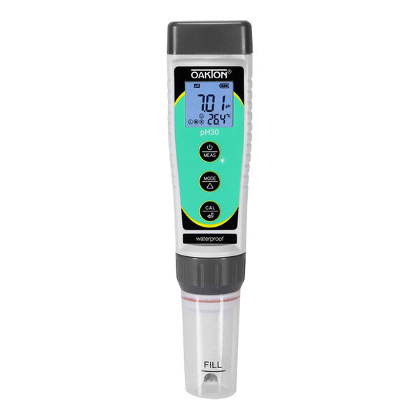 A close-up of a Micro Matic hand held electronic pH meter with a green screen.