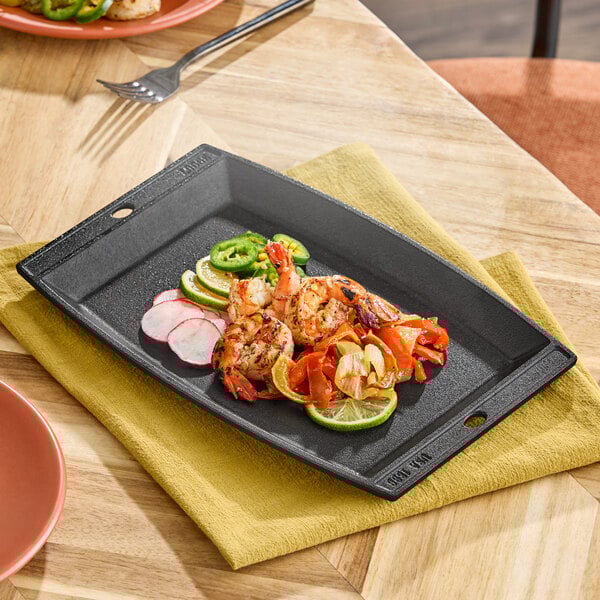 A rectangular pre-seasoned cast iron fajita skillet.