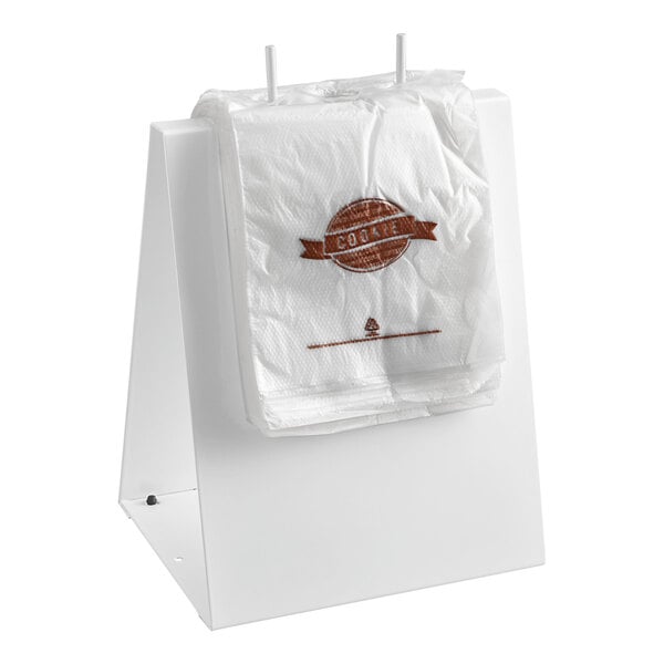 A white deli saddle bag stand holding a stack of 5 1/2" x 5 1/2" cookie bags with a flip top.