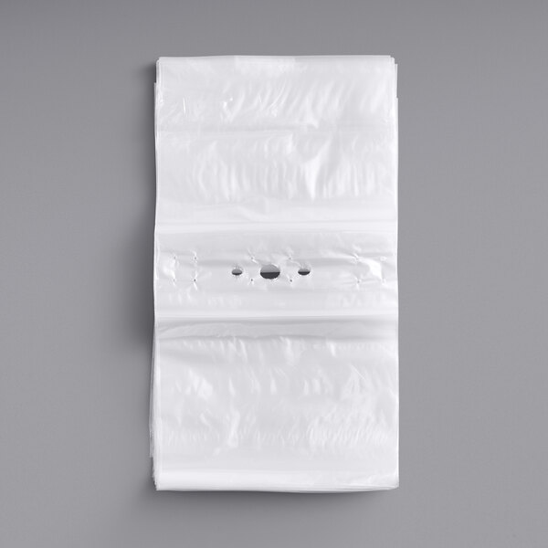 A white plastic Choice Deli saddle bag with holes.