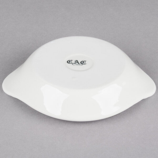 A white stoneware shirred egg dish.