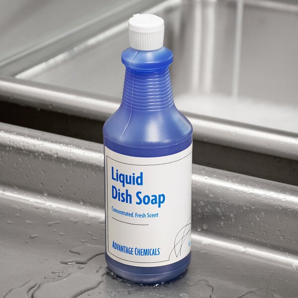 A blue bottle of Advantage Chemicals liquid dish soap with a white label on a countertop.