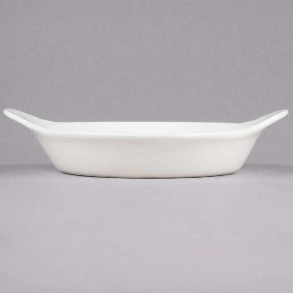 A white rectangular CAC stoneware dish with handles.