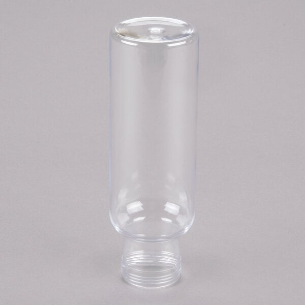 A clear plastic Cal-Mil salad dressing bottle with a cap.