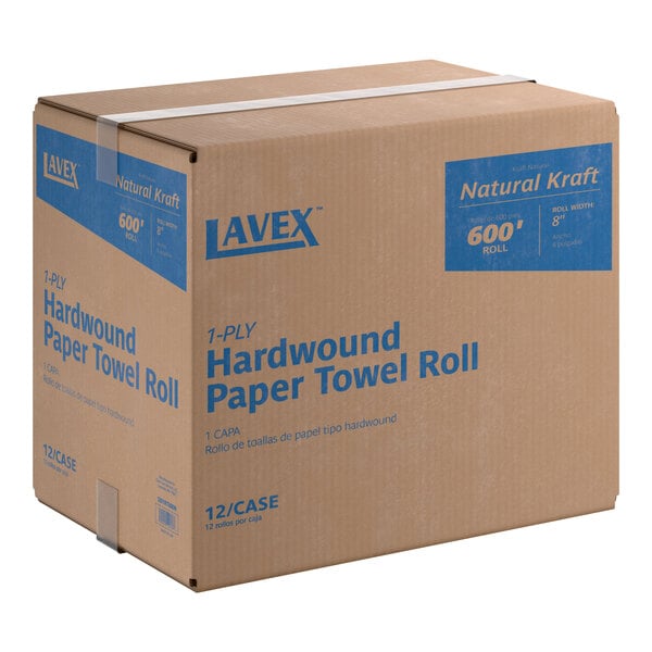A cardboard box containing 12 rolls of Lavex Natural Kraft hardwound paper towels, each roll 600 feet long.