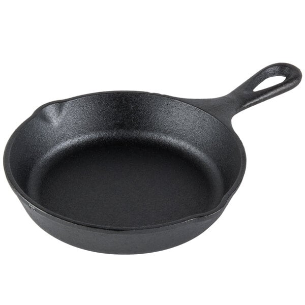 A Lodge pre-seasoned cast iron skillet with a handle.