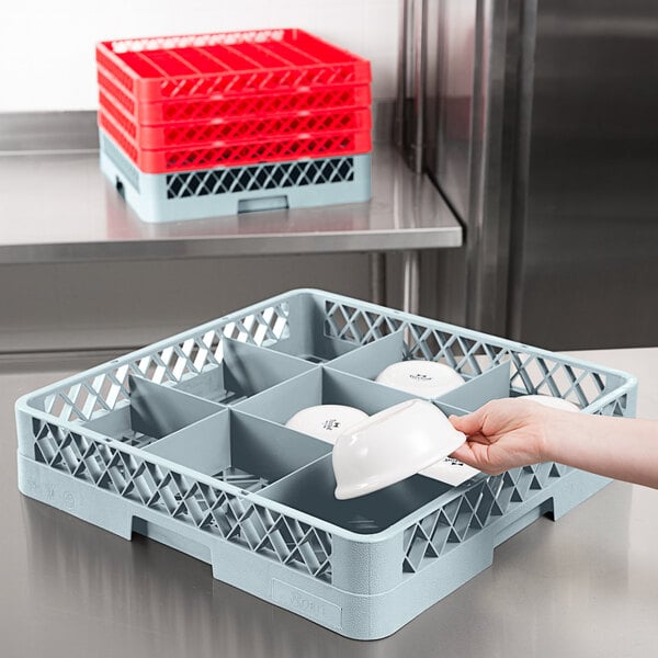 A person using a Noble Products gray glass rack on a counter.