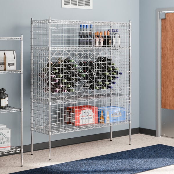 A Regency chrome wire security cage filled with bottles and boxes on metal shelves.