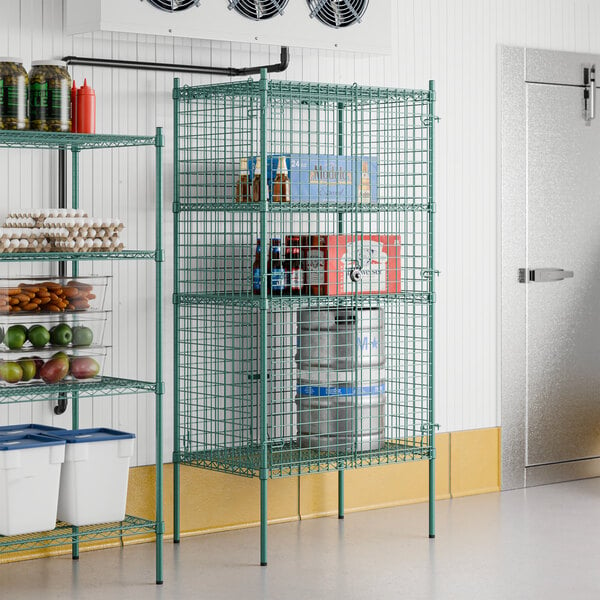 A Regency green wire security cage kit for a metal shelving unit in a winery cellar.