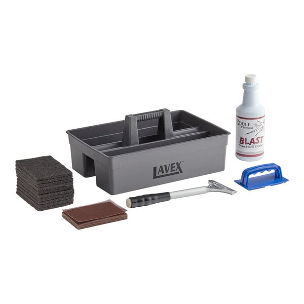 A gray plastic caddy with a handle, a bottle of cleaner, a blue scrub pad holder, a scraper tool, and stacks of scrub pads are arranged together.