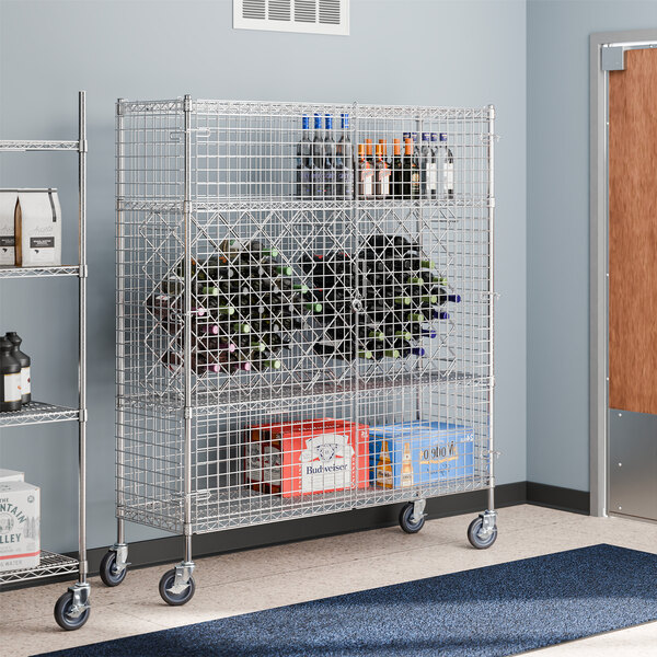 A Regency chrome wire security cage cart with wine bottles on it.