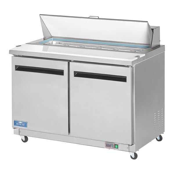 An Arctic Air stainless steel 48" 2 door refrigerated sandwich prep table.