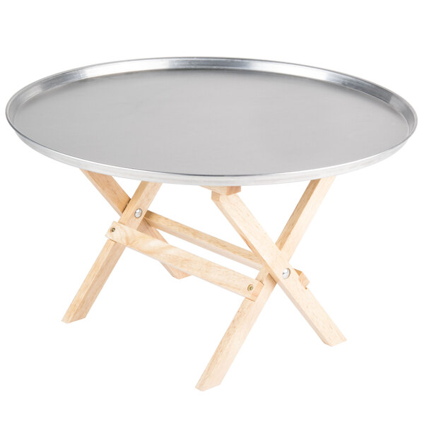 A Tablecraft mini table tray stand with a natural finish on a round table.