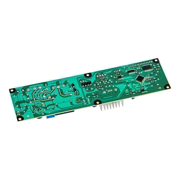 A green Turbo Air PCB board with many small chips on a circuit board.