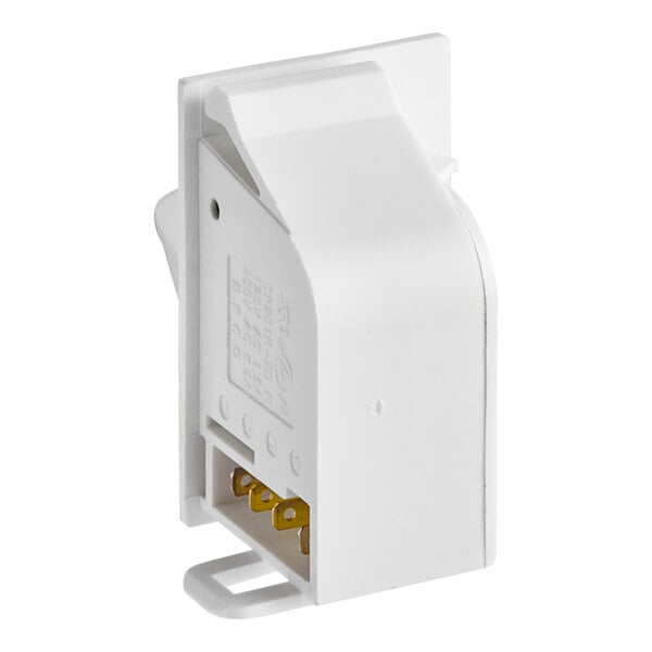 A white rectangular Turbo Air door light switch with two gold connectors.