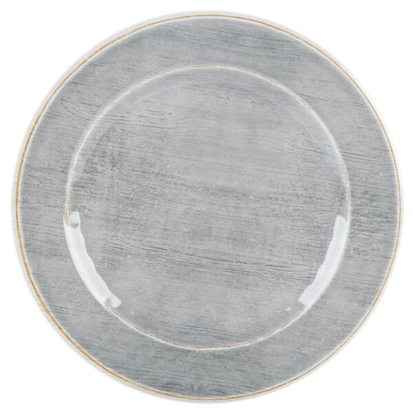 A smoke gray Carlisle melamine bread and butter plate with a white rim and a gold rim.