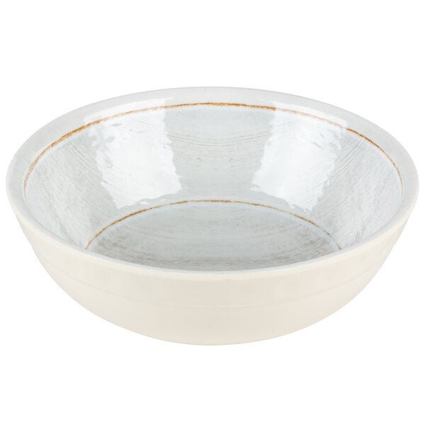 A white bowl with a brown rim.