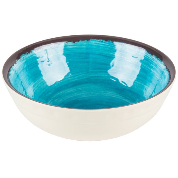 A blue bowl with a white rim.