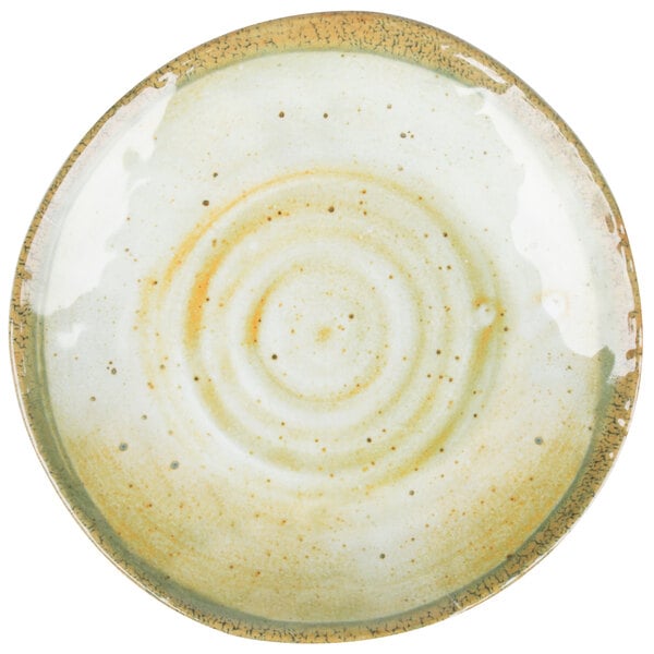 A white round melamine bread and butter plate with a brown circular design.