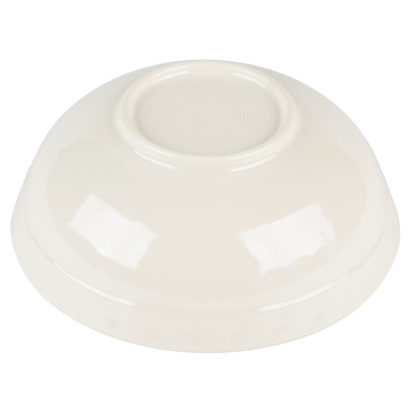 A jade melamine bowl with a white background.