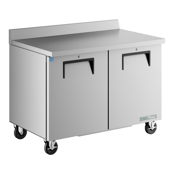 A large stainless steel True worktop refrigerator with two doors.