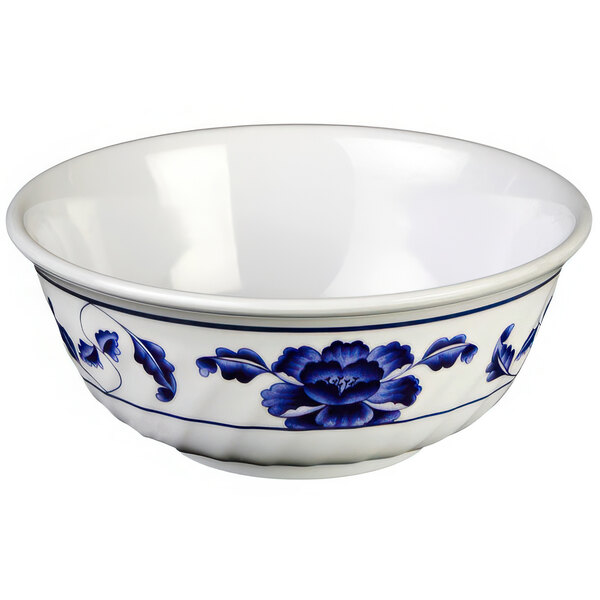 A white melamine bowl with blue flowers and swirls.