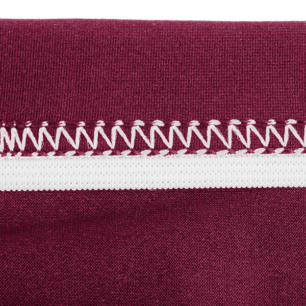 A burgundy Snap Drape spandex table cover with maroon and white stripes.