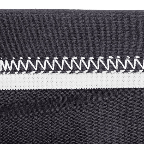 A close up of a black Snap Drape Contour table cover with white stitching.