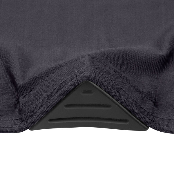 A close-up of the black spandex fabric with a charcoal triangle on the corner.