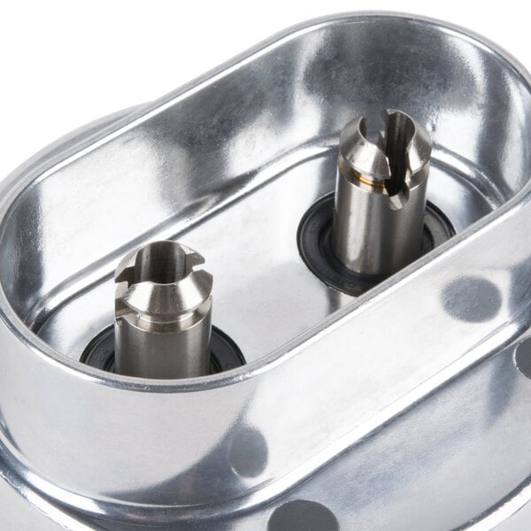 A metal Robot Coupe whisk attachment gearbox with two holes.