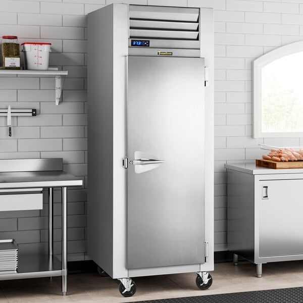 A Traulsen G Series reach-in refrigerator with a solid door.