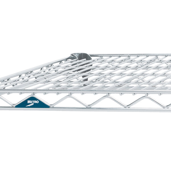 A Metro Super Erecta Brite wire shelf with a blue label.