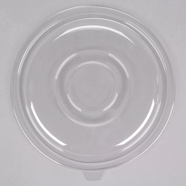 A clear plastic lid with a circular rim on a white background.