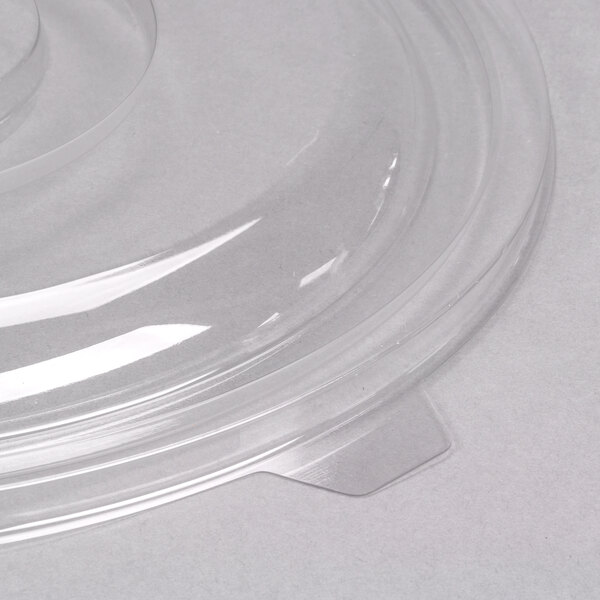 A clear plastic lid for a Fineline clear plastic bowl.