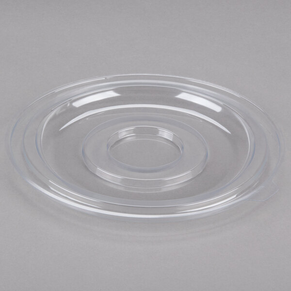 A clear plastic lid with a circular hole on a white background.