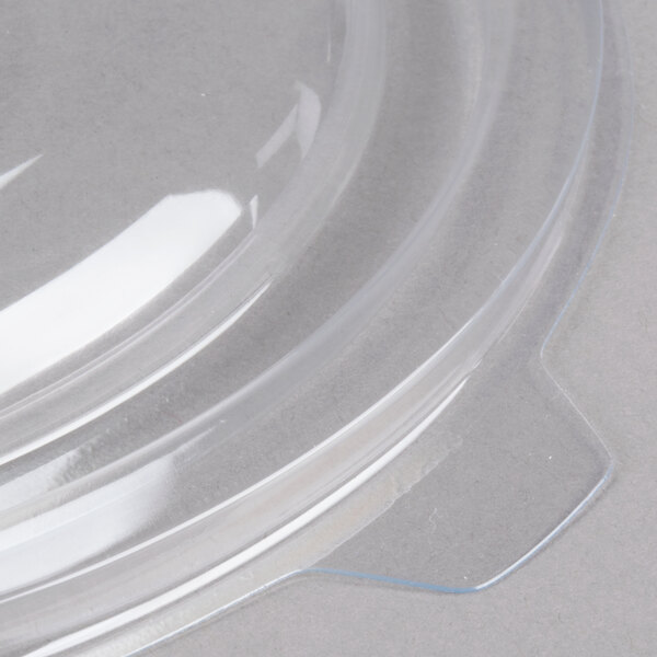 A clear plastic lid for a Fineline clear plastic bowl.