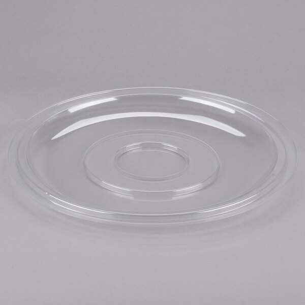 A clear plastic Fineline flat lid with a hole in the middle over a white circle.