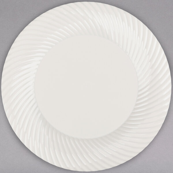 A white Visions plastic plate with a swirl pattern.