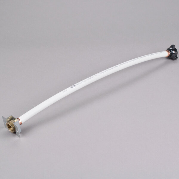 A white pipe with a black handle.