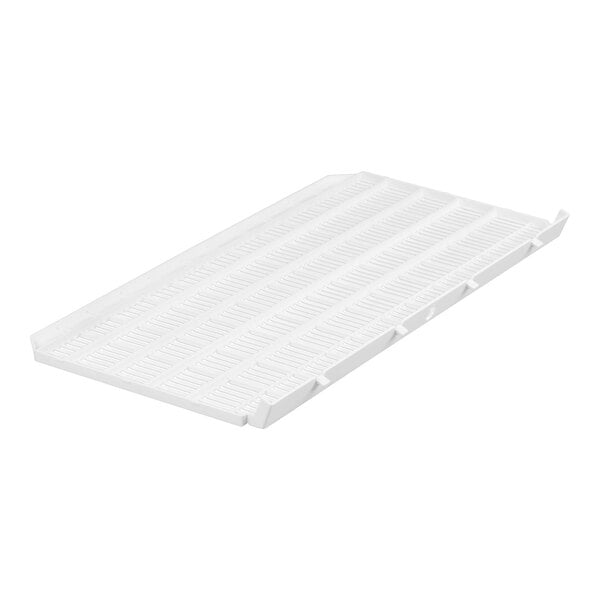 A white, rectangular plastic tray with a grid-like pattern and raised edges.