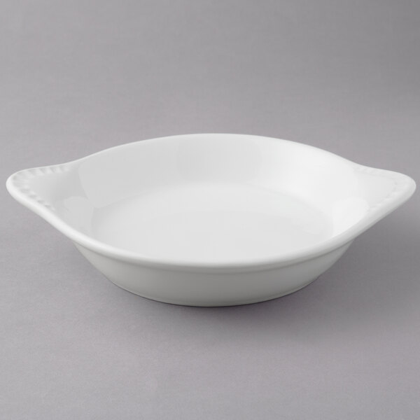 a white bowl with a handle