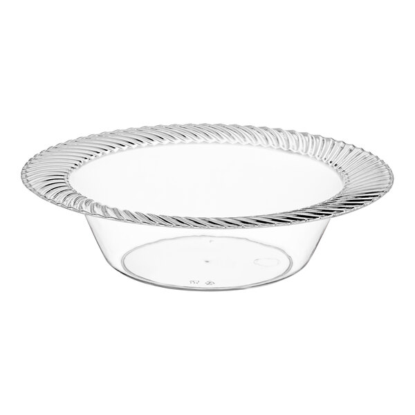 A clear plastic bowl with a wave design on the rim.