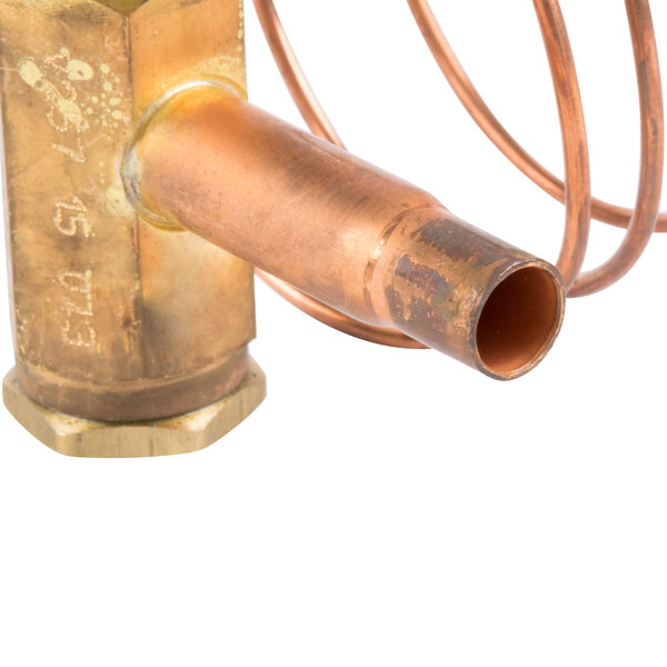 A close-up of a Hoshizaki expansion valve on a copper tube.