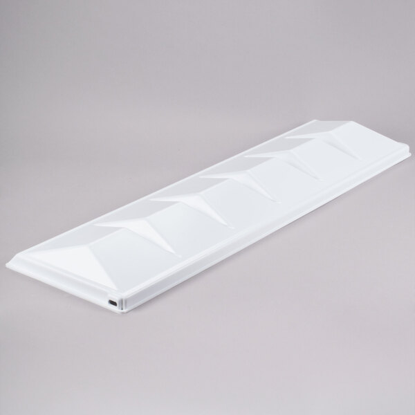 A white rectangular plastic baffle with holes.