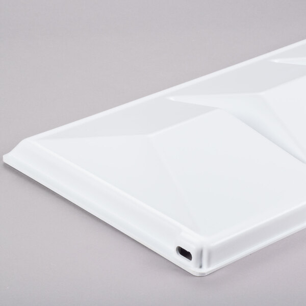 A white rectangular Hoshizaki baffle with a hole in the middle.