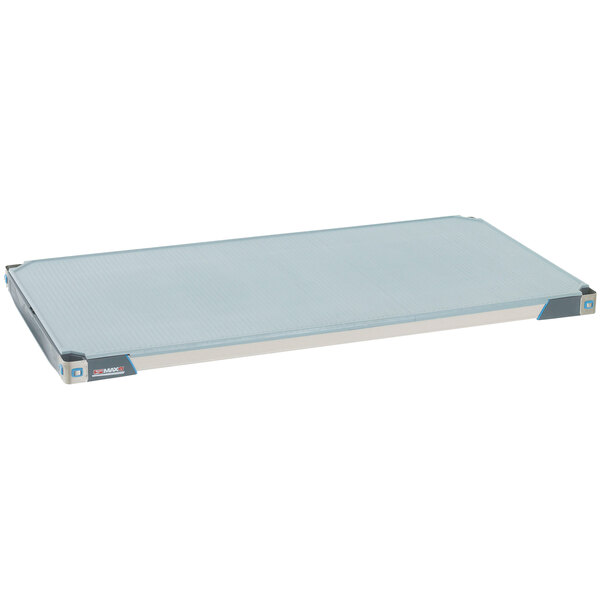 A white rectangular MetroMax i polymer shelf with a blue border and a blue solid mat.