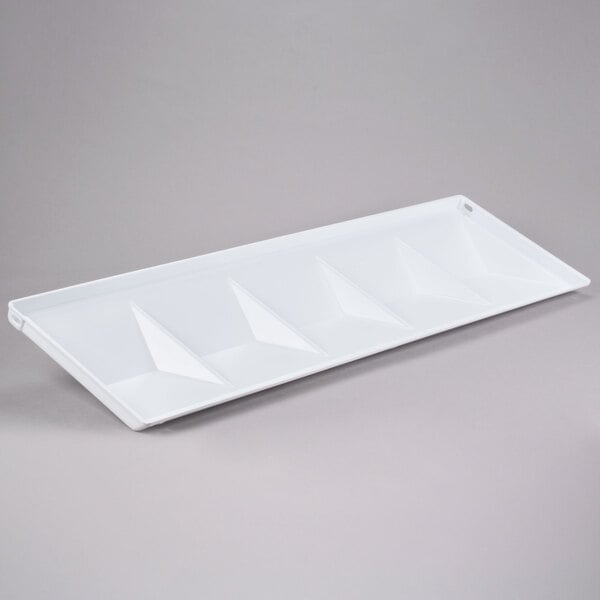 A white rectangular plate with triangular shapes on it.