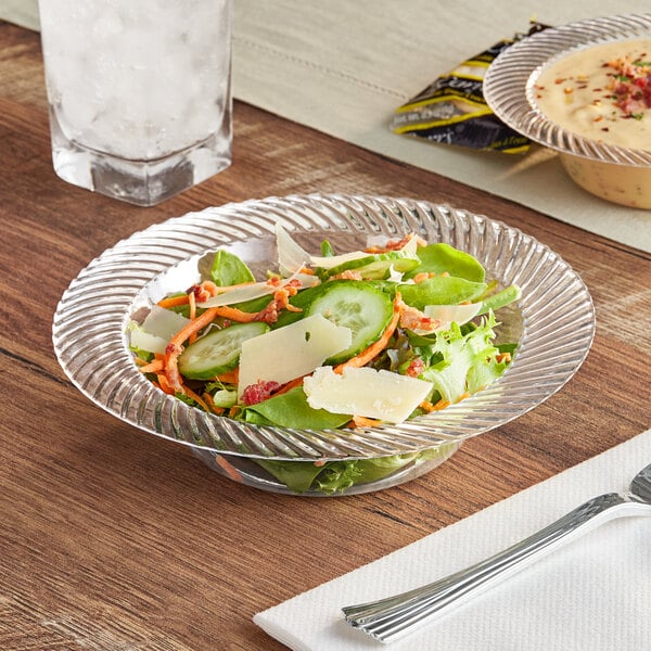 A bowl of salad on a table.