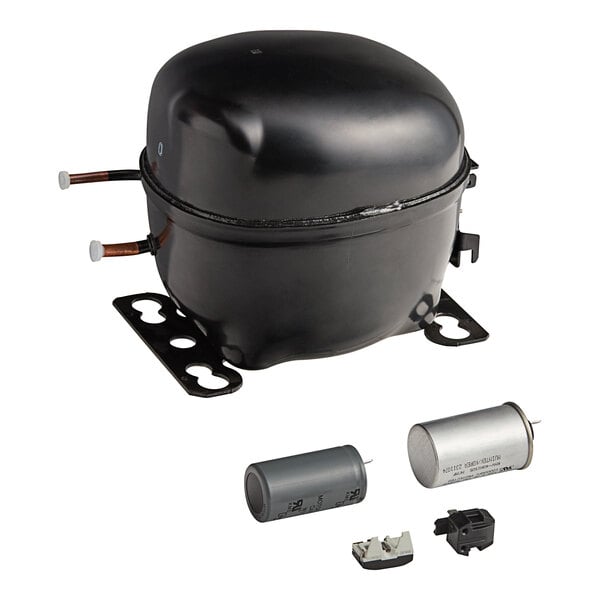 A black Turbo Air refrigeration compressor with a small motor and pump inside.